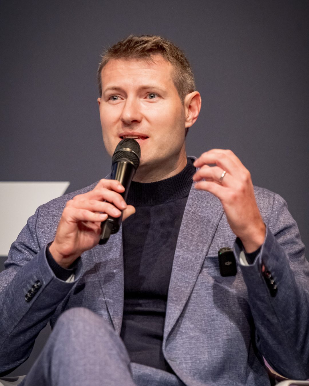 Nicolas speaking on a finance panel